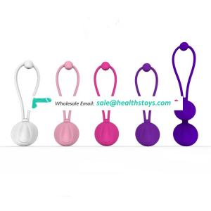 Healthy women product different weighted kegel balls exercises for pelvic muscle